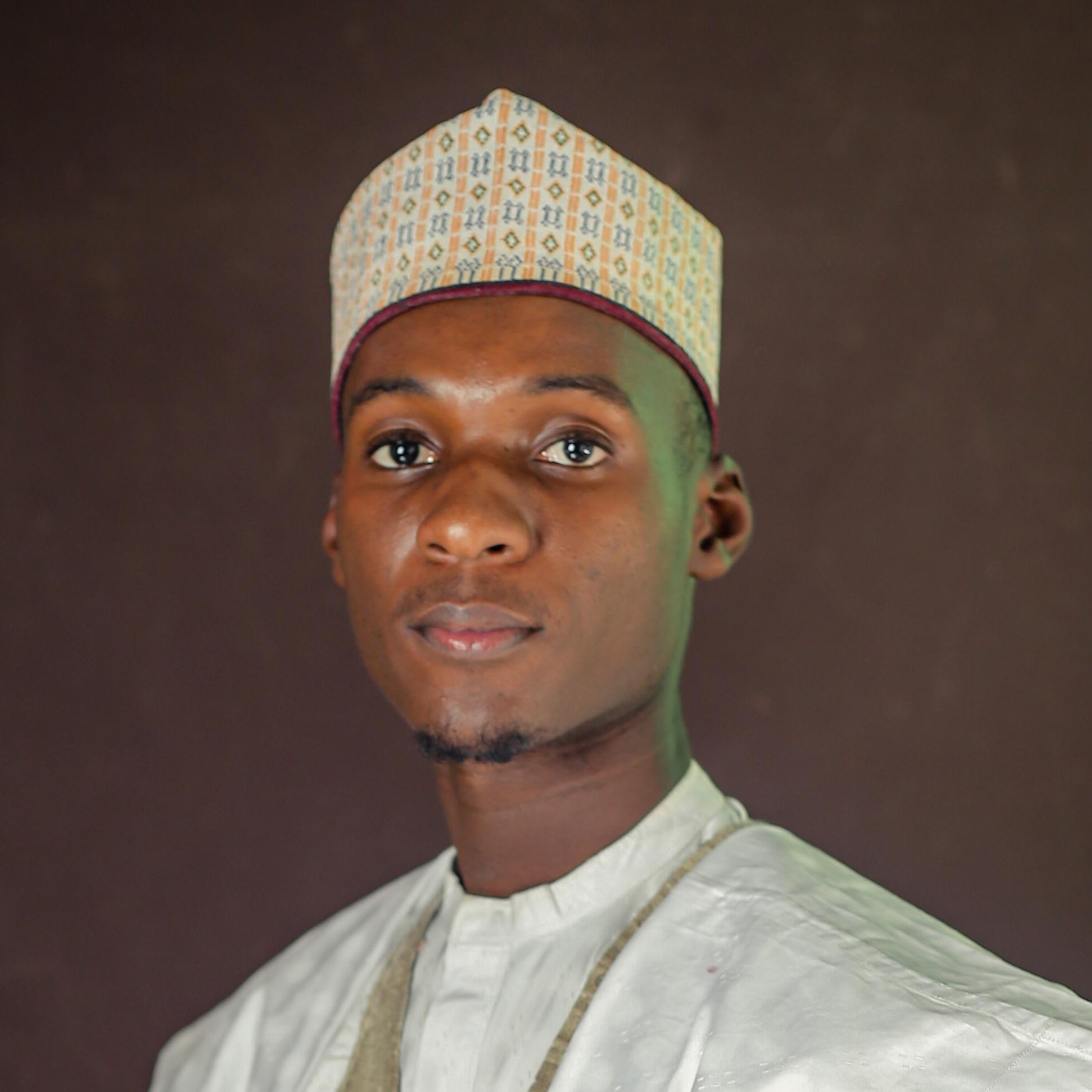 A portrait of a young man dressed on northern regalia