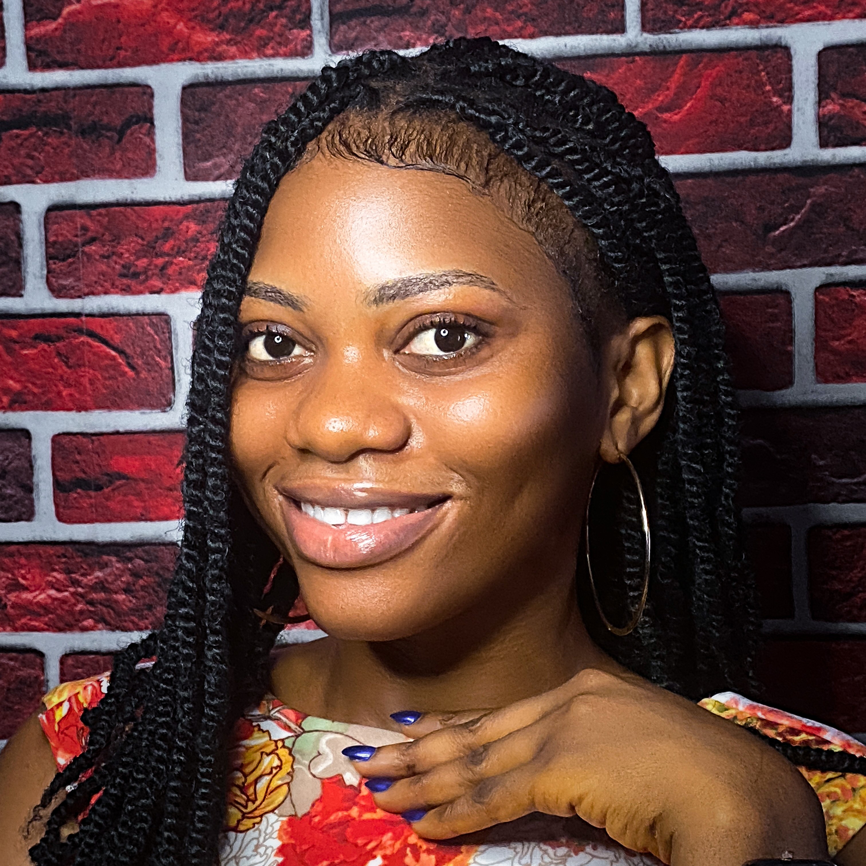A portrait of a young female smiling.