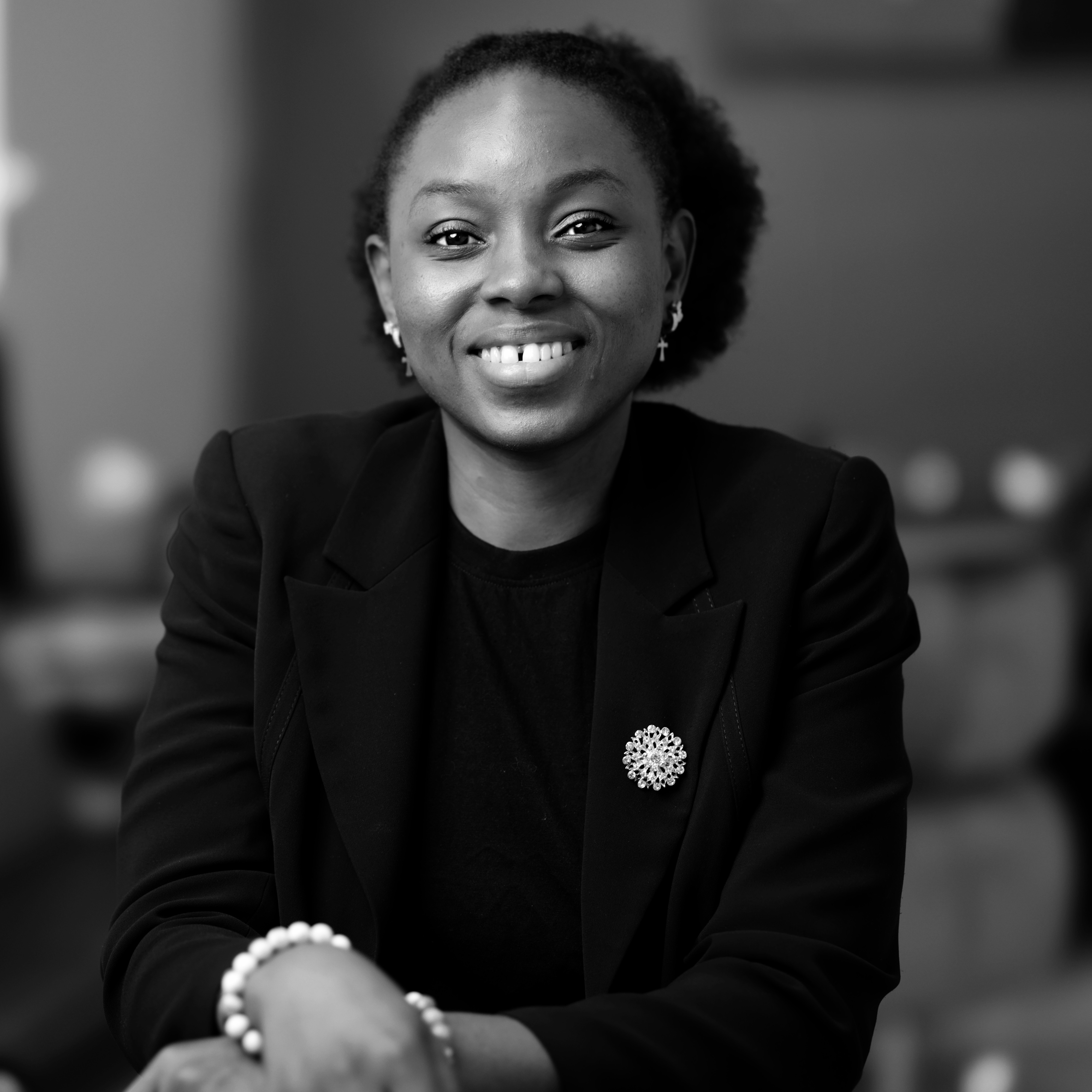 A portrait of a lady smiling.