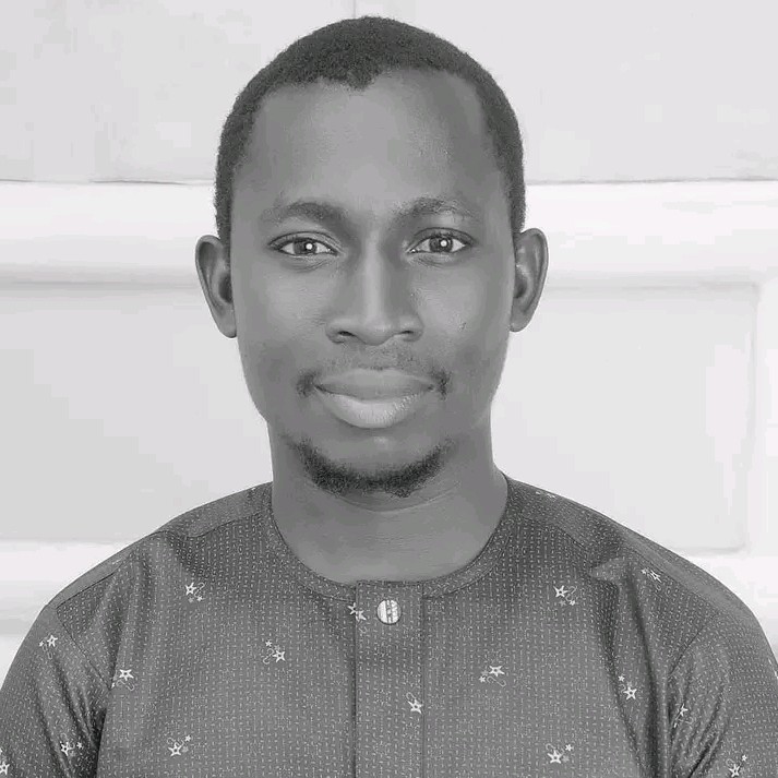 A portrait of a young man looking at the camera.