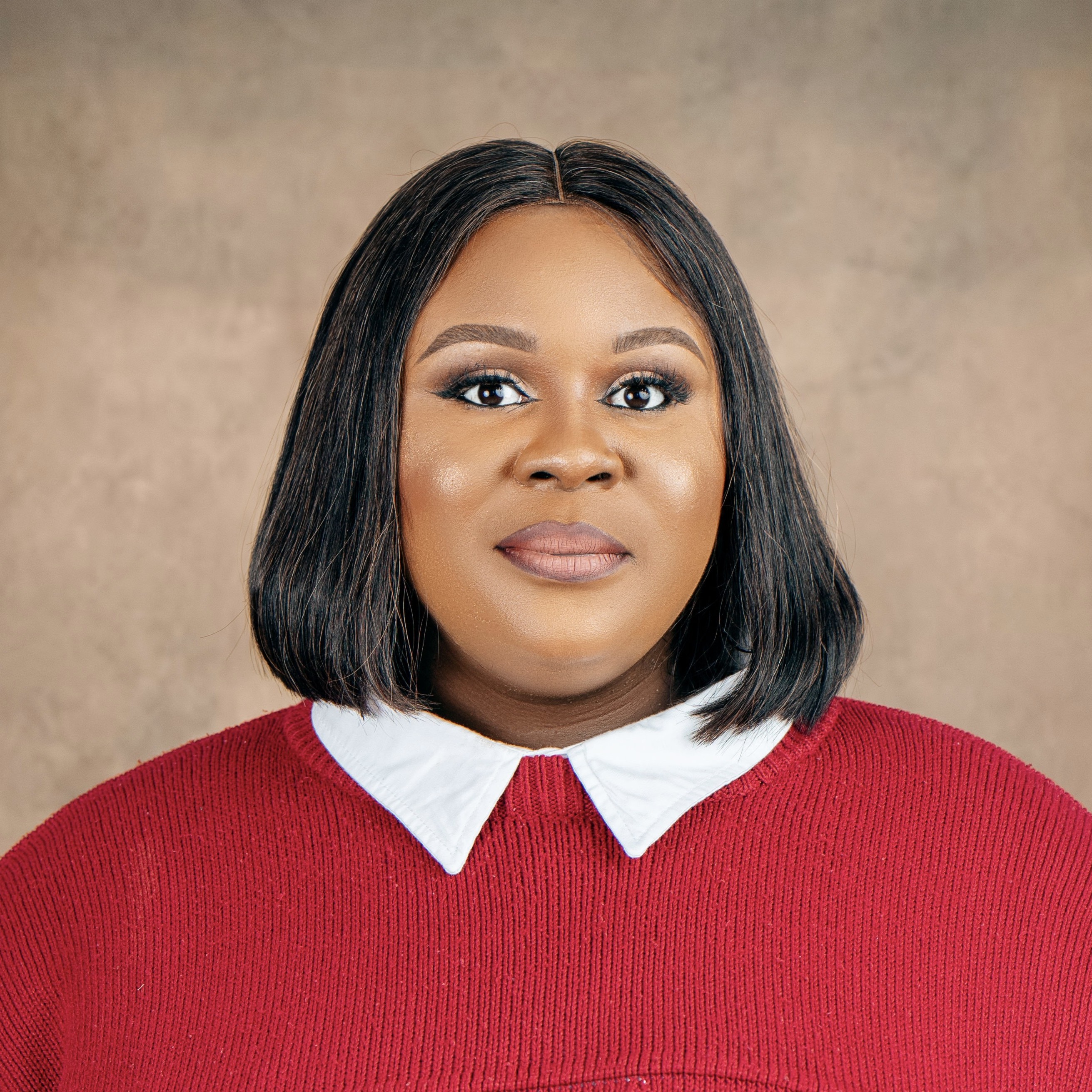 A portrait of a lady dressed in white and red jacket.