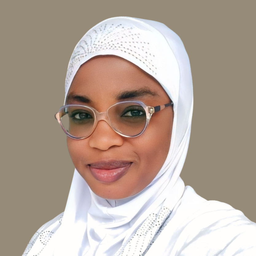 A portrait of a Muslim young lady wearing a white hijab.