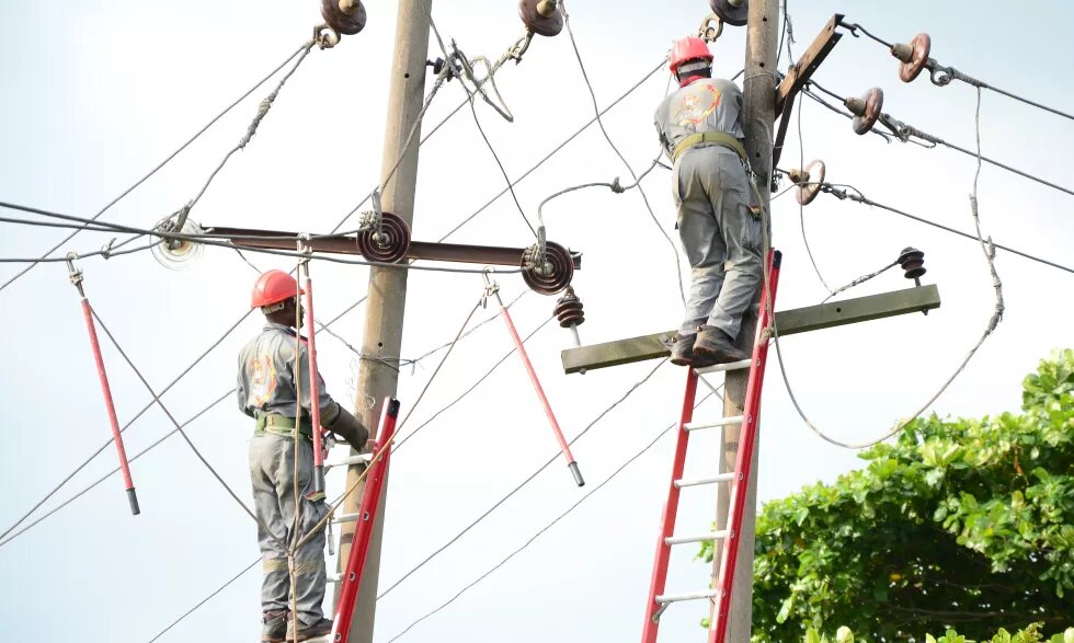 Power distributor engineers are working on the damaged pole in Lagos Nigeria, 23rd June 2019. Nigeria