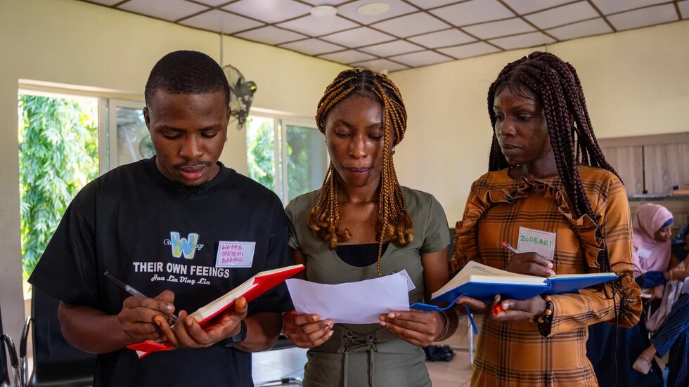 Three young Nigerians presenting during their Green academy.